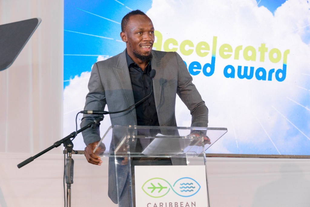 Usain Bolt speaking at the Caribbean Climate-Smart Accelerator podium